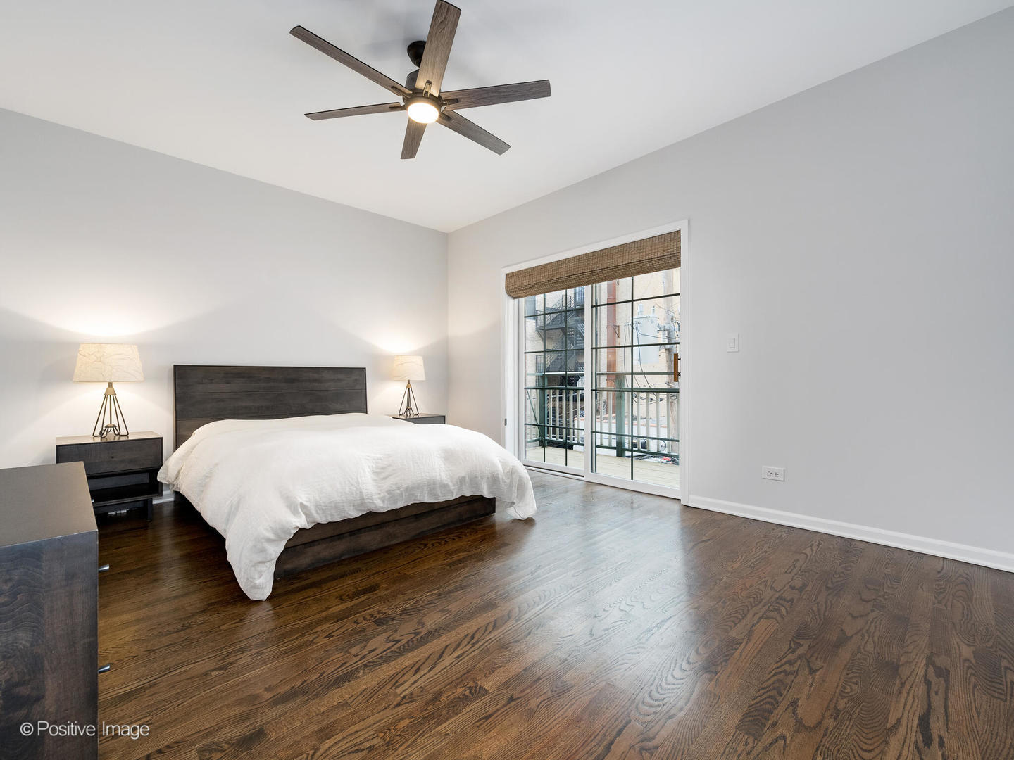 1038 West Monroe Street, Unit 34 Chicago, IL 60607 - Photo 15 of 28 a bedroom with a large bed and a large window