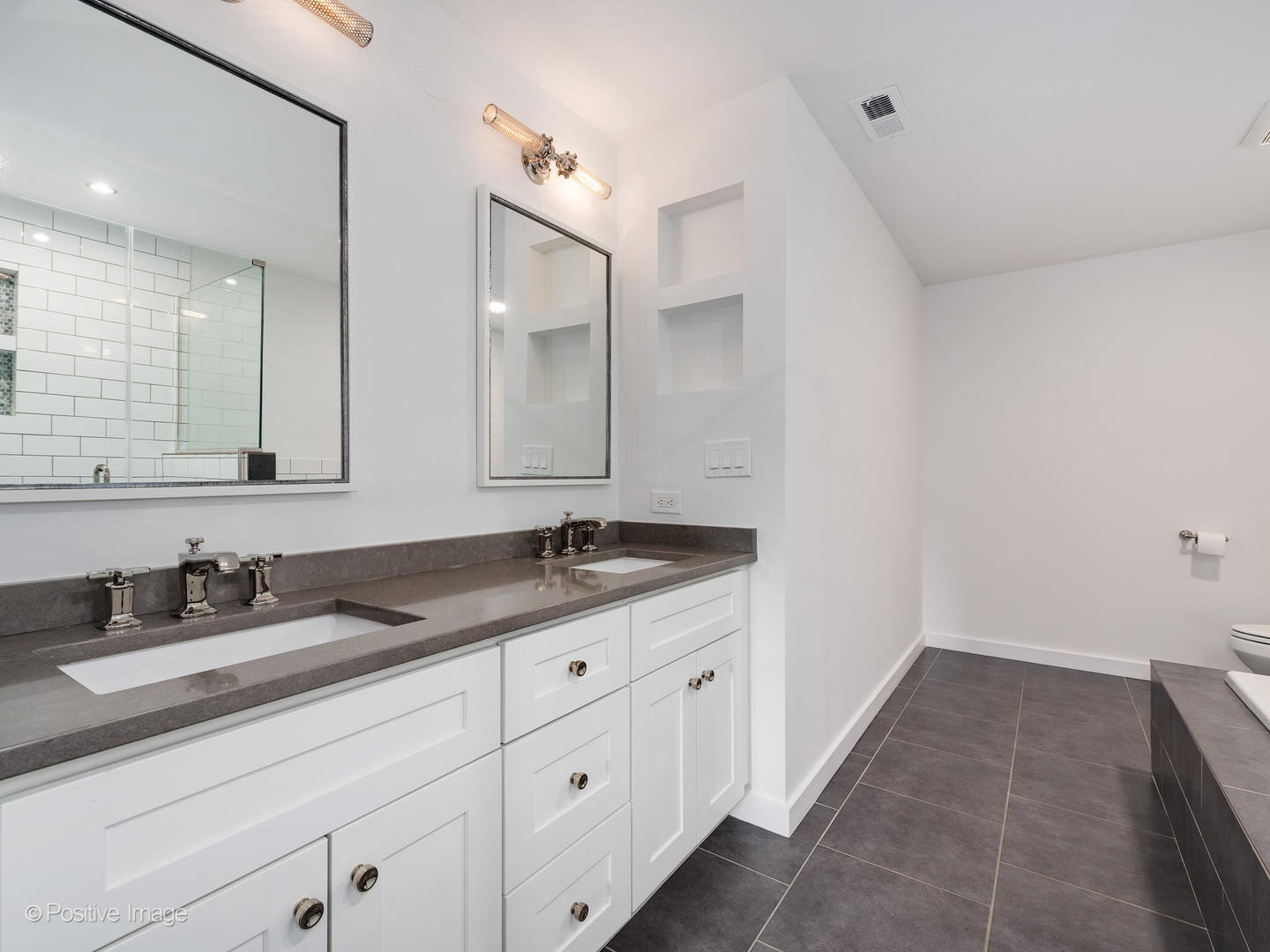 1038 West Monroe Street, Unit 34 Chicago, IL 60607 - Photo 18 of 28 a bathroom with a granite countertop sink double and mirror