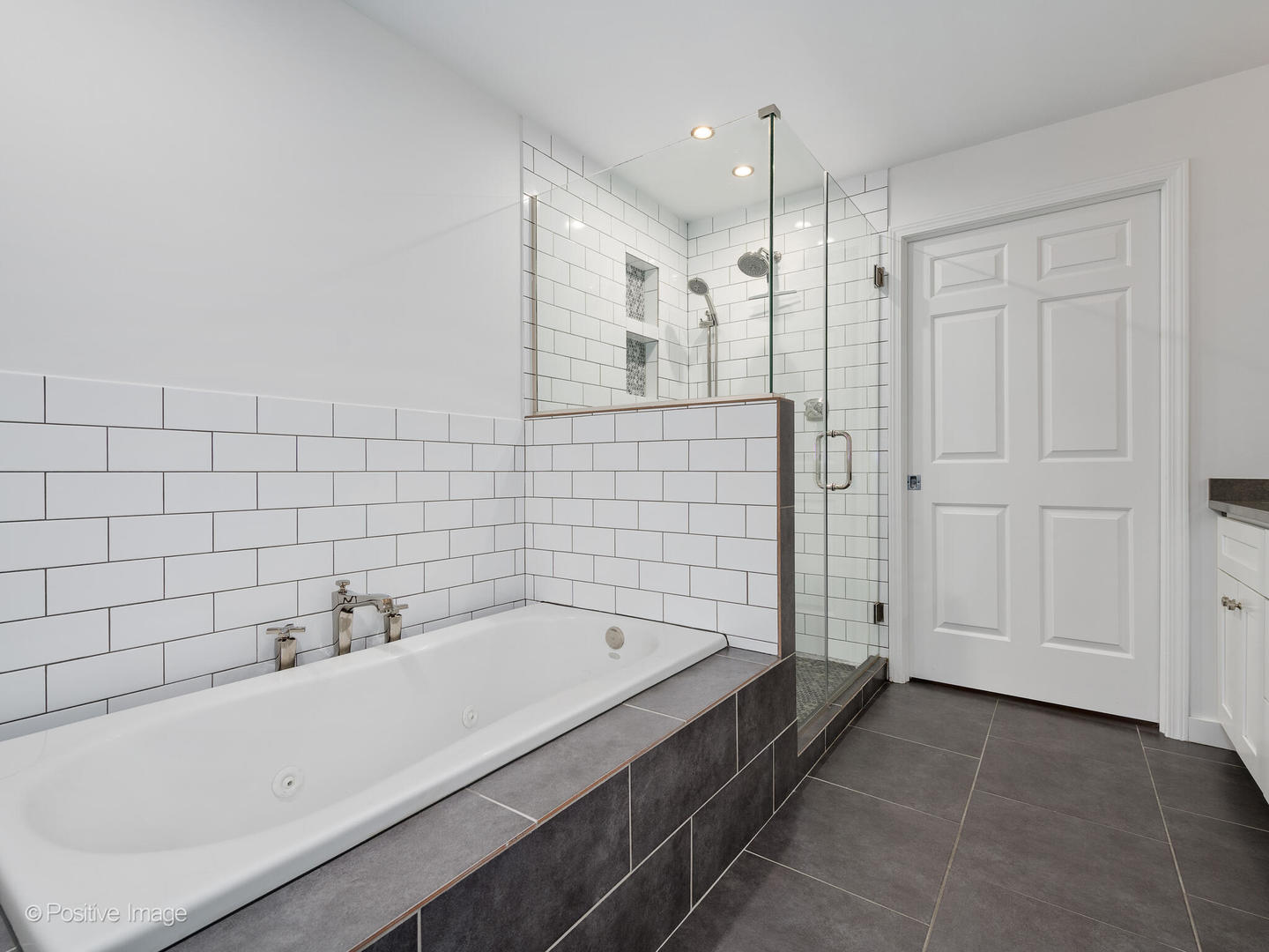1038 West Monroe Street, Unit 34 Chicago, IL 60607 - Photo 19 of 28 a bathroom with a bathtub and shower