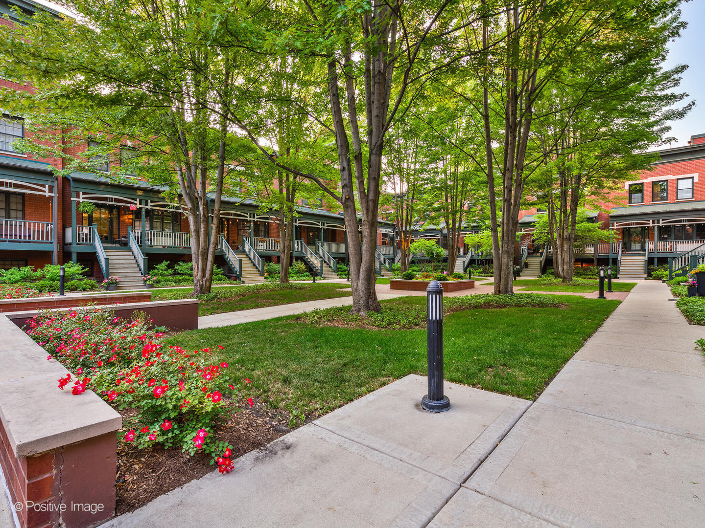 1038 West Monroe Street, Unit 34 Chicago, IL 60607 - Photo 27 of 28 a view of a garden with flowers and trees