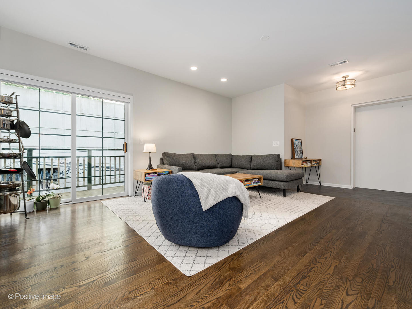 1038 West Monroe Street, Unit 34 Chicago, IL 60607 - Photo 3 of 28 a living room with furniture and a wooden floor