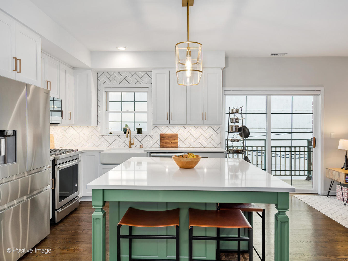 1038 West Monroe Street, Unit 34 Chicago, IL 60607 - Photo 10 of 28 a kitchen with a table chairs microwave and cabinets