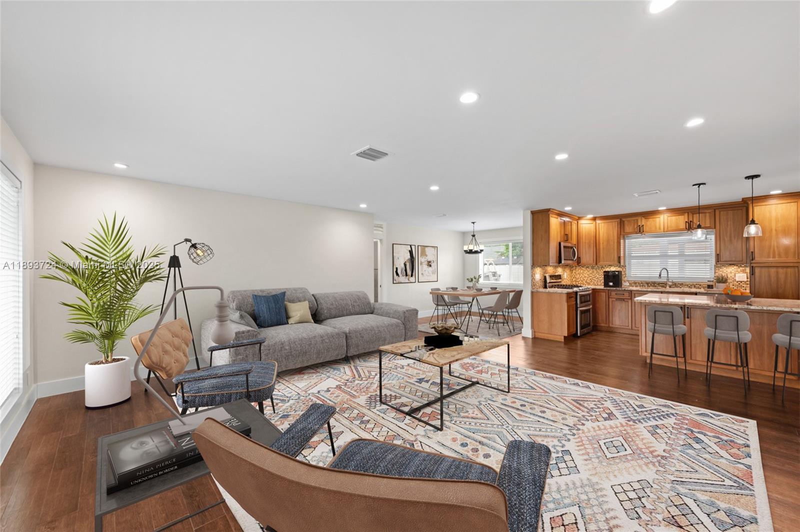 8440 Southwest 201st Street Cutler Bay, FL 33189 - Photo 1 of 31 a living room with furniture a couch and a potted plant
