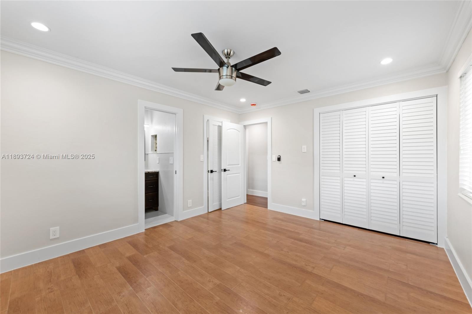 8440 Southwest 201st Street Cutler Bay, FL 33189 - Photo 17 of 31 a view of a livingroom with a ceiling fan & entryway