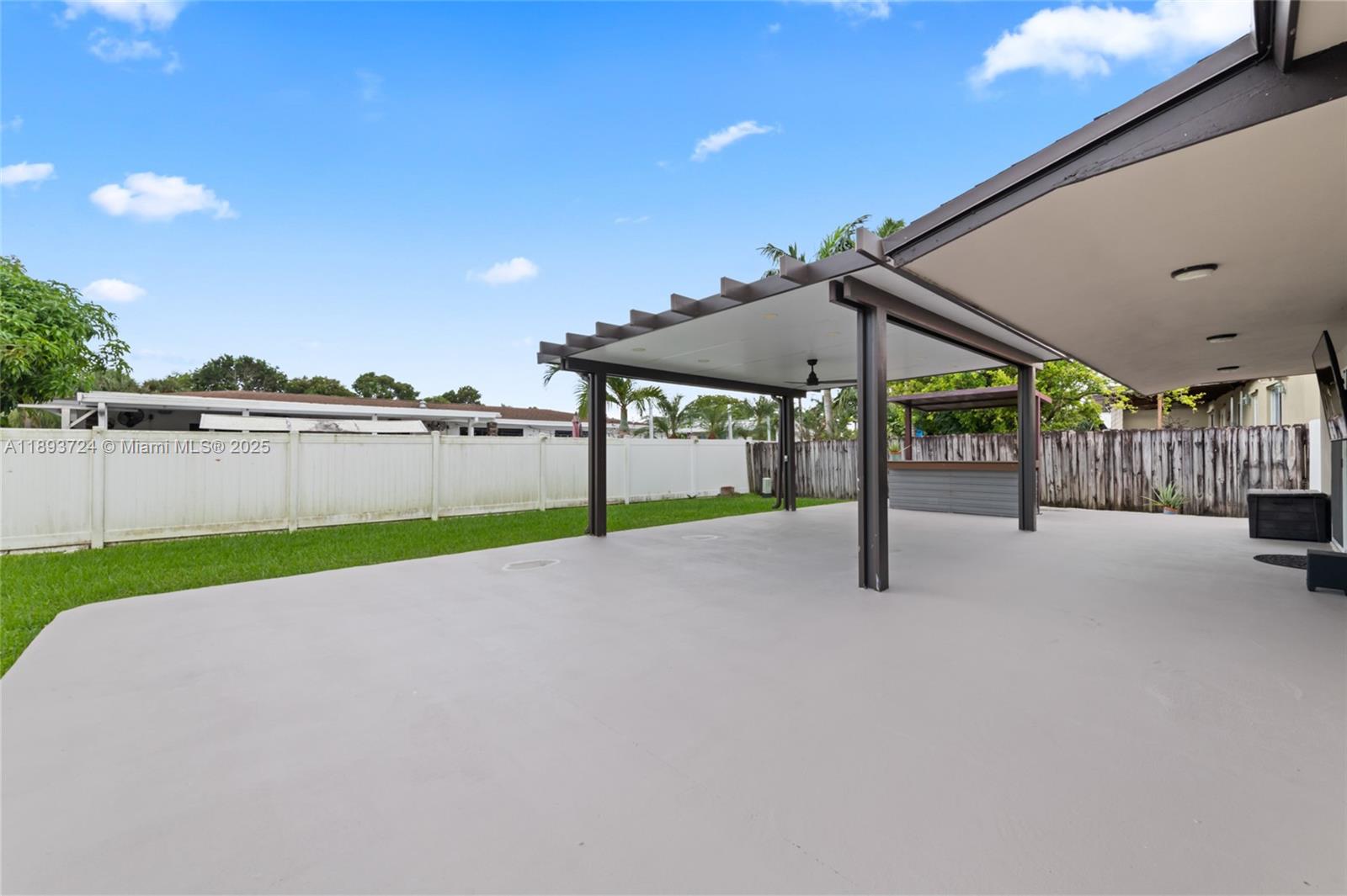 8440 Southwest 201st Street Cutler Bay, FL 33189 - Photo 22 of 31 a view of a terrace with a yard