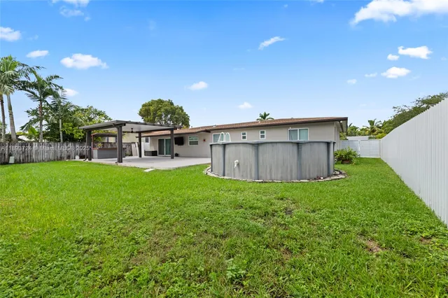 a view of a chair and table in the garden