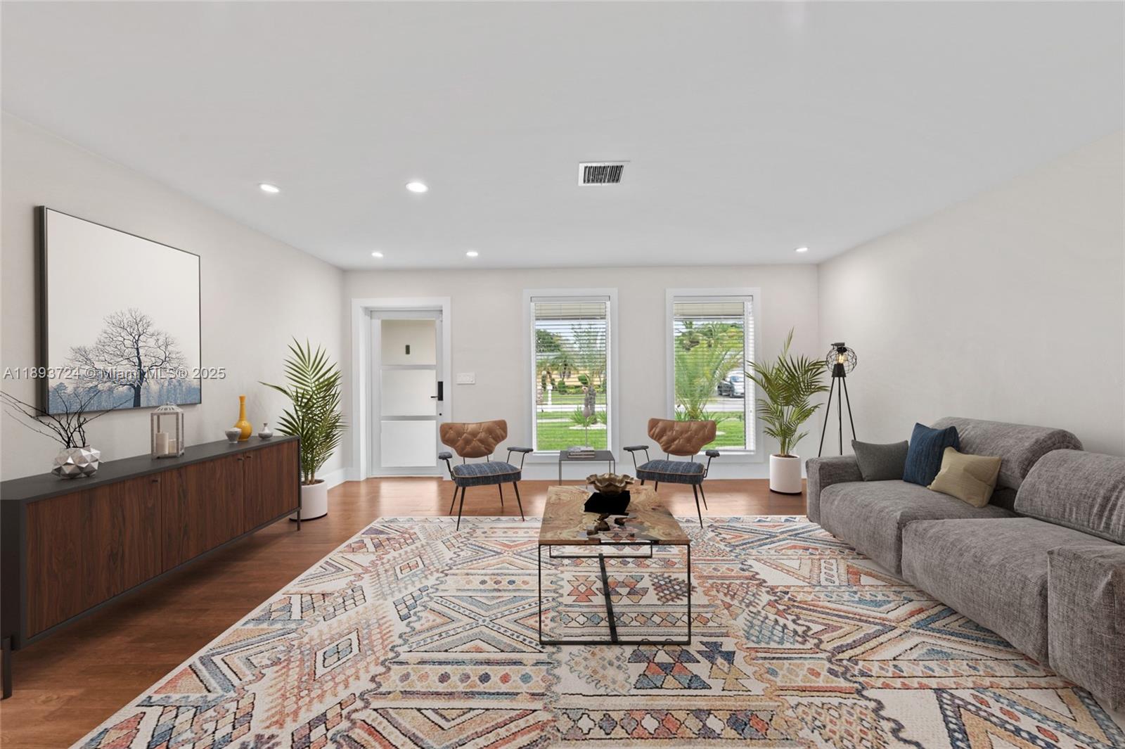 8440 Southwest 201st Street Cutler Bay, FL 33189 - Photo 3 of 31 a living room with furniture and wooden floor