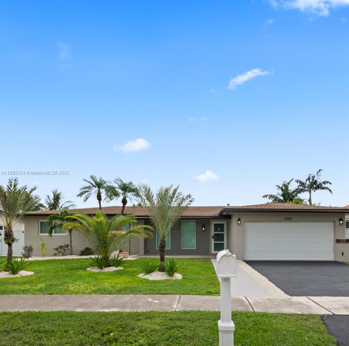 8440 Southwest 201st Street Cutler Bay, FL 33189 - Photo 5 of 31 a front view of a house with garden