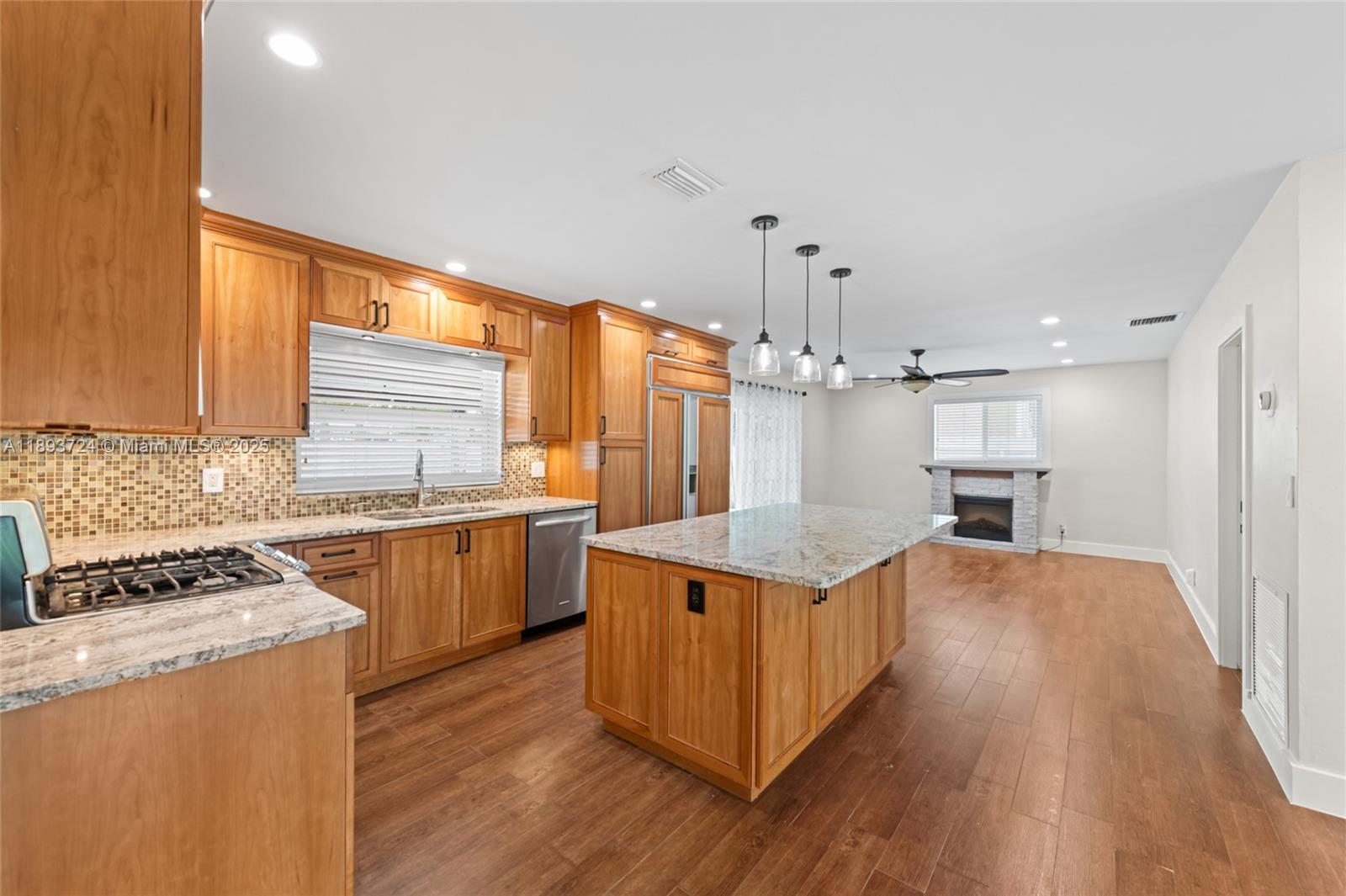 8440 Southwest 201st Street Cutler Bay, FL 33189 - Photo 10 of 31 a kitchen with stainless steel appliances granite countertop a sink stove and refrigerator