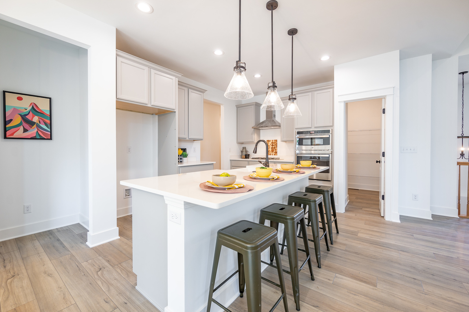 5S252 Deerpath Road Aurora, IL 60506 - Photo 11 of 32 a kitchen with stainless steel appliances kitchen island a island in the center and wooden floors
