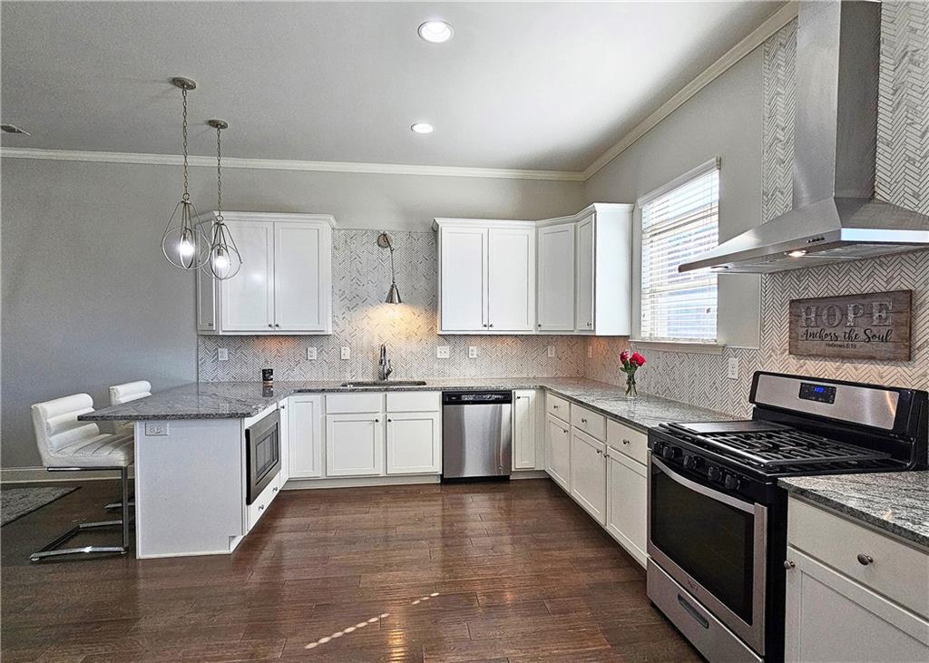 1212 Stone Castle Circle Smyrna, GA 30080 - Photo 17 of 39 a kitchen with a sink stove and cabinets
