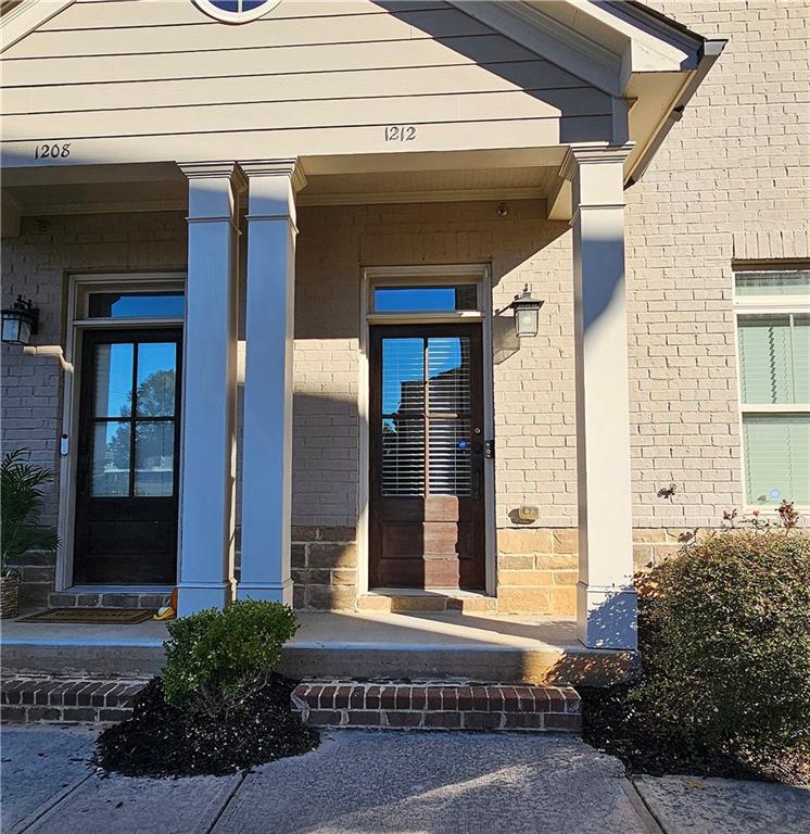 1212 Stone Castle Circle Smyrna, GA 30080 - Photo 2 of 39 a front view of a house with a outdoor space
