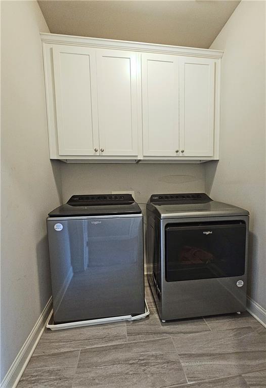 1212 Stone Castle Circle Smyrna, GA 30080 - Photo 30 of 39 a kitchen with granite countertop white cabinets and a stove with wooden floor