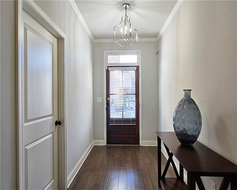 1212 Stone Castle Circle Smyrna, GA 30080 - Photo 3 of 39 a view of a livingroom with furniture and wooden floor