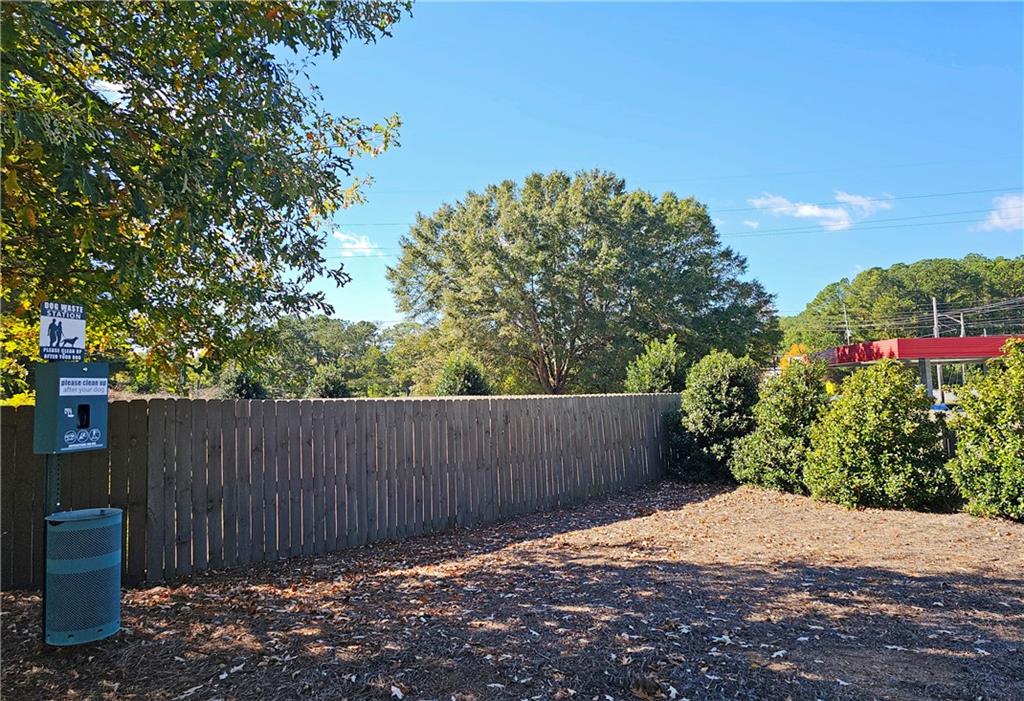 1212 Stone Castle Circle Smyrna, GA 30080 - Photo 39 of 39 a wooden fence with trees in the background