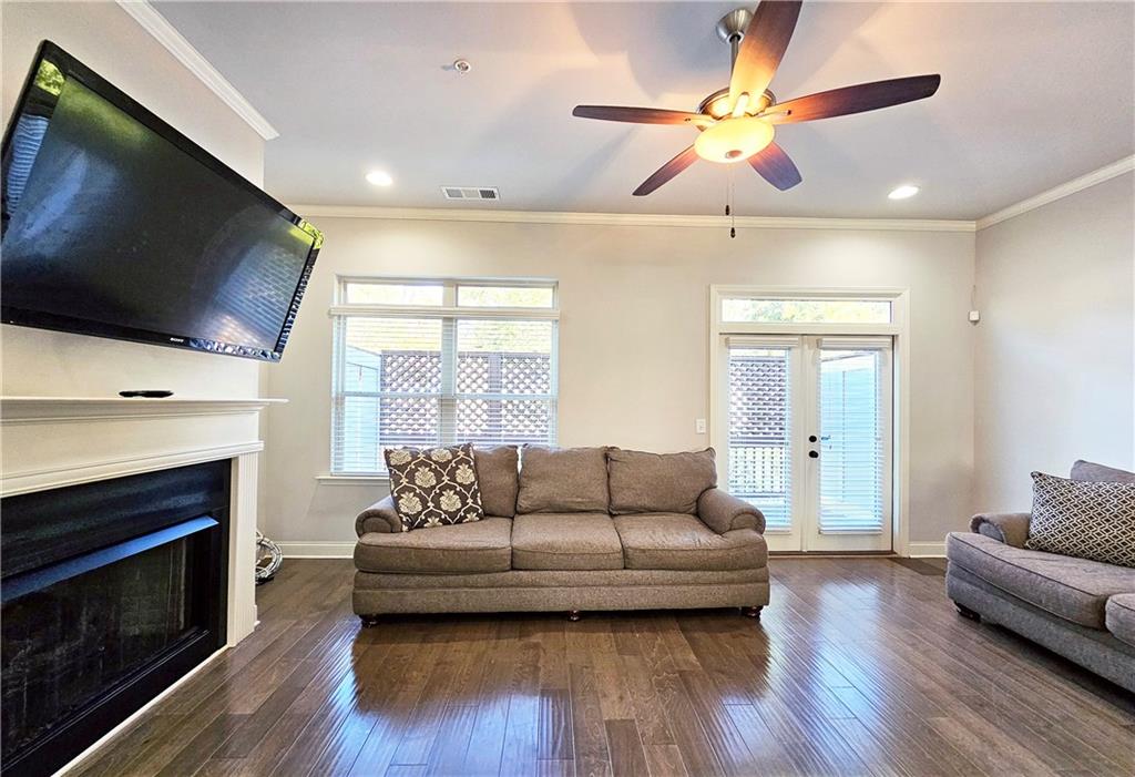 1212 Stone Castle Circle Smyrna, GA 30080 - Photo 7 of 39 a living room with furniture fireplace and flat screen tv
