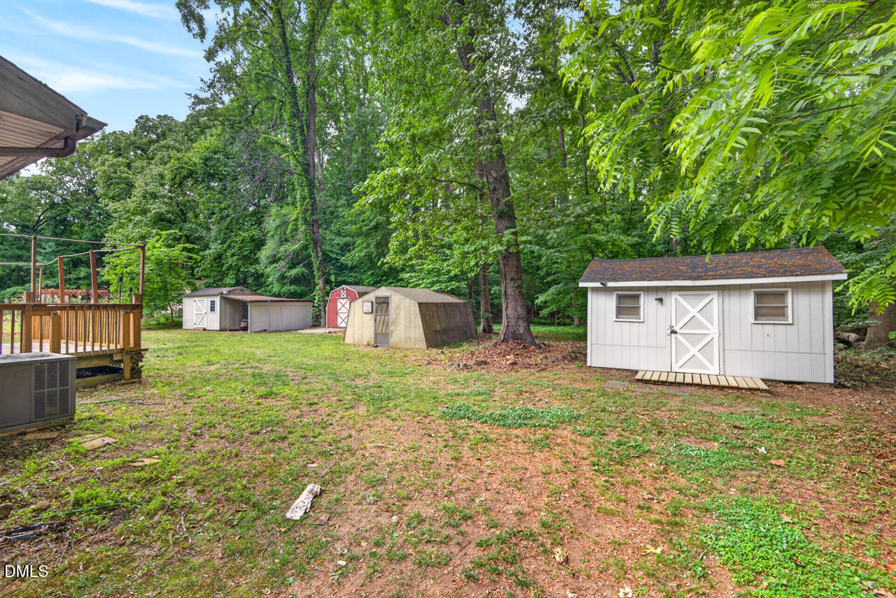 1420 Goodwin Road Durham, NC 27712 - Photo 48 of 54 a house that has a tree in front of it