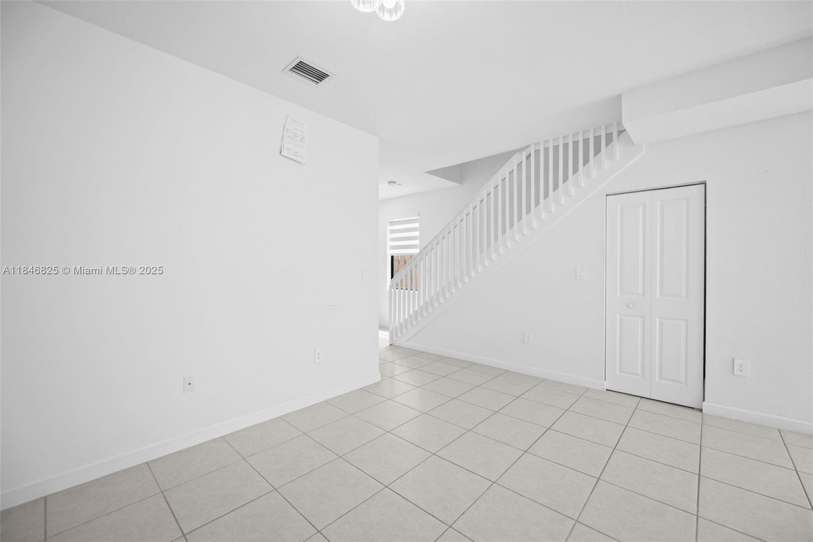 12965 Southwest 233rd Terrace Homestead, FL 33032 - Photo 13 of 25 a view of an entryway with white walls