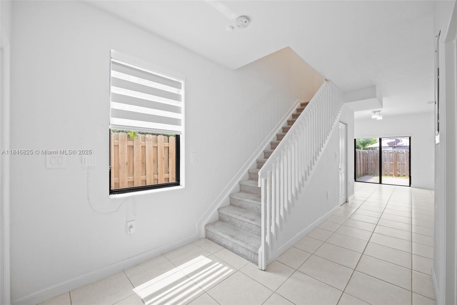 12965 Southwest 233rd Terrace Homestead, FL 33032 - Photo 14 of 25 a view of entryway and hall with a window