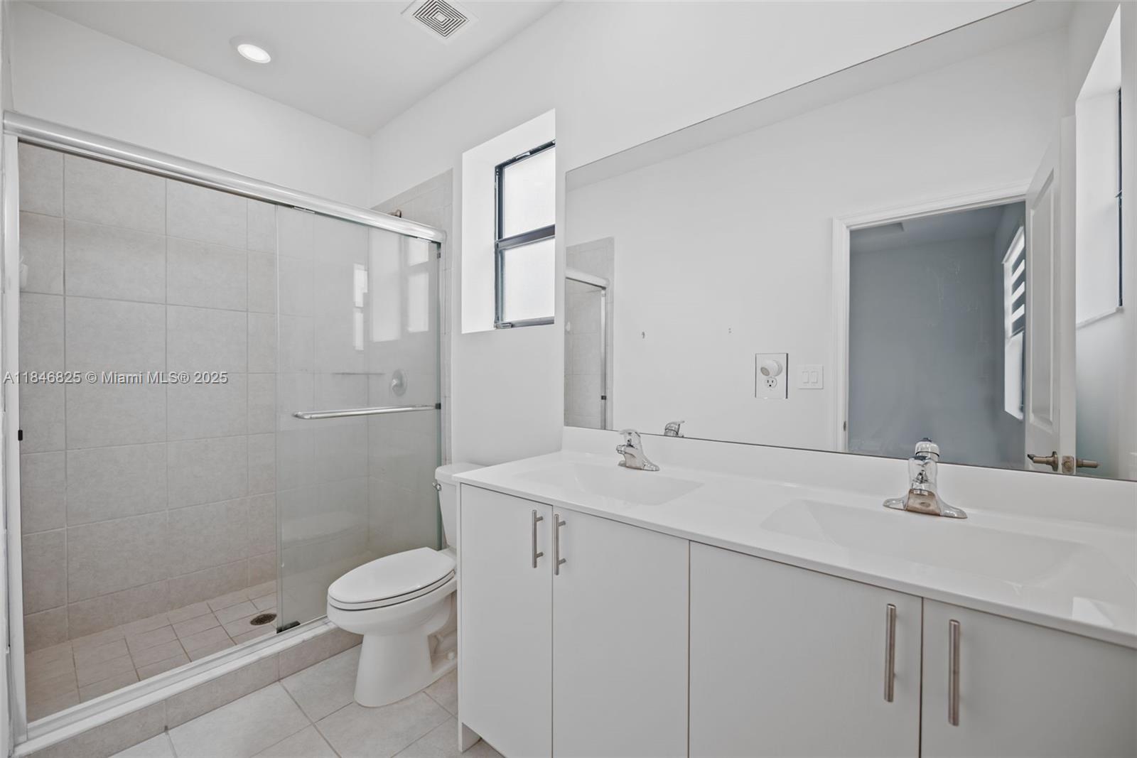 12965 Southwest 233rd Terrace Homestead, FL 33032 - Photo 17 of 25 a bathroom with a sink toilet a mirror and shower