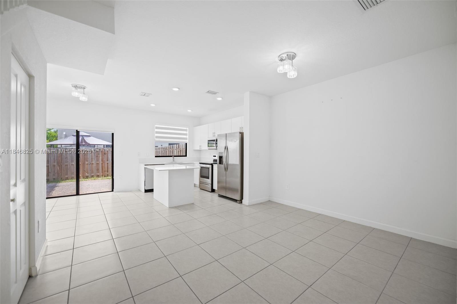 12965 Southwest 233rd Terrace Homestead, FL 33032 - Photo 4 of 25 a view of a kitchen with a sink