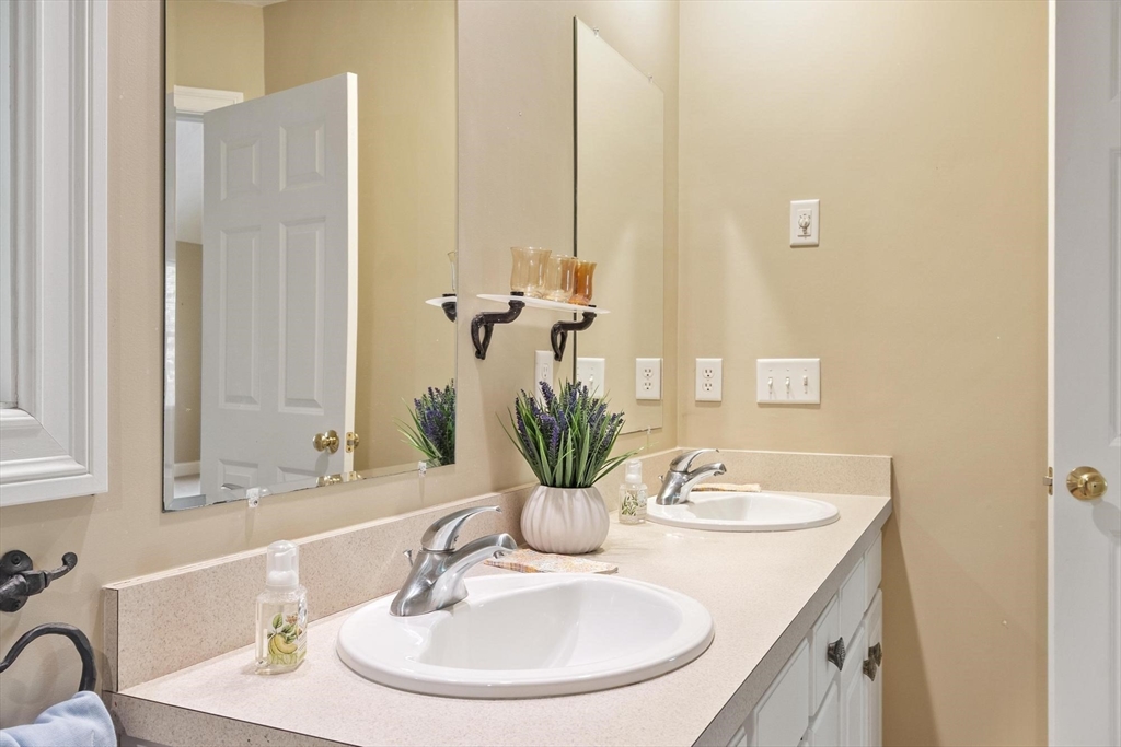 4 Forest Street Georgetown, MA 01833 - Photo 23 of 37 a bathroom with a sink and a mirror
