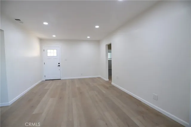 a view of an empty room and window