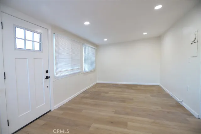 a bathroom with a sink a light fixture and a mirror