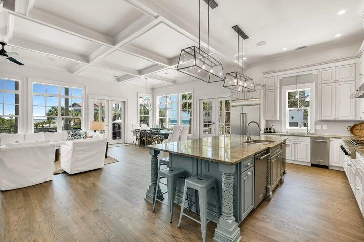 410 Beachfront Trail Santa Rosa Beach, FL 32459 - Photo 23 of 102 a large kitchen with a table and chairs