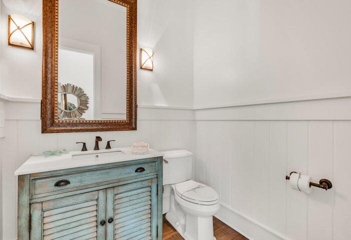 410 Beachfront Trail Santa Rosa Beach, FL 32459 - Photo 24 of 102 a bathroom with a sink a toilet and mirror