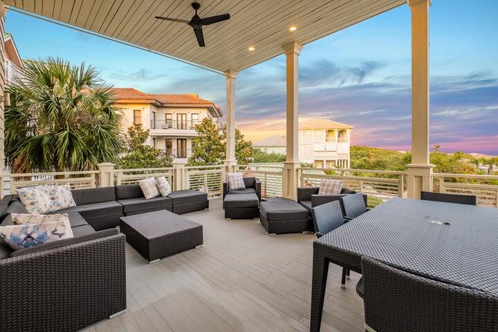 410 Beachfront Trail Santa Rosa Beach, FL 32459 - Photo 25 of 102 a living room with furniture and floor to ceiling windows