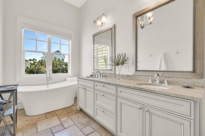 410 Beachfront Trail Santa Rosa Beach, FL 32459 - Photo 30 of 102 a bathroom with a tub sink and mirror