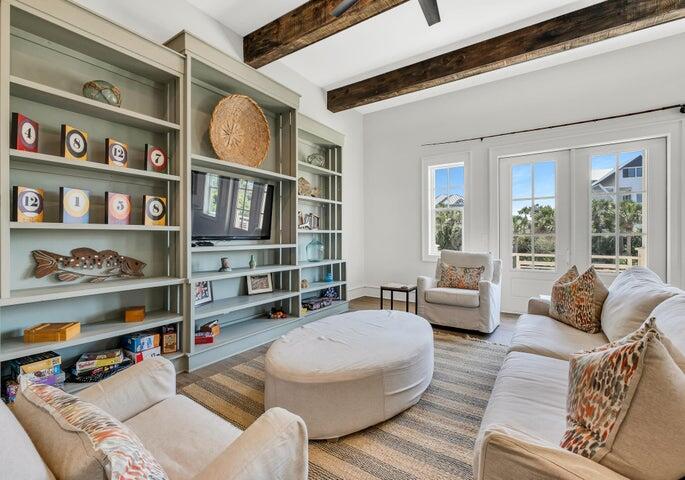410 Beachfront Trail Santa Rosa Beach, FL 32459 - Photo 33 of 102 a living room with furniture and a book shelf