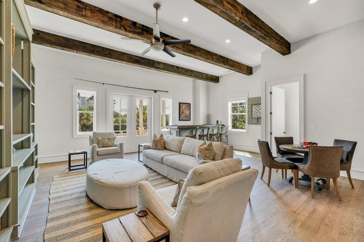 410 Beachfront Trail Santa Rosa Beach, FL 32459 - Photo 34 of 102 a living room with furniture and a wooden floor