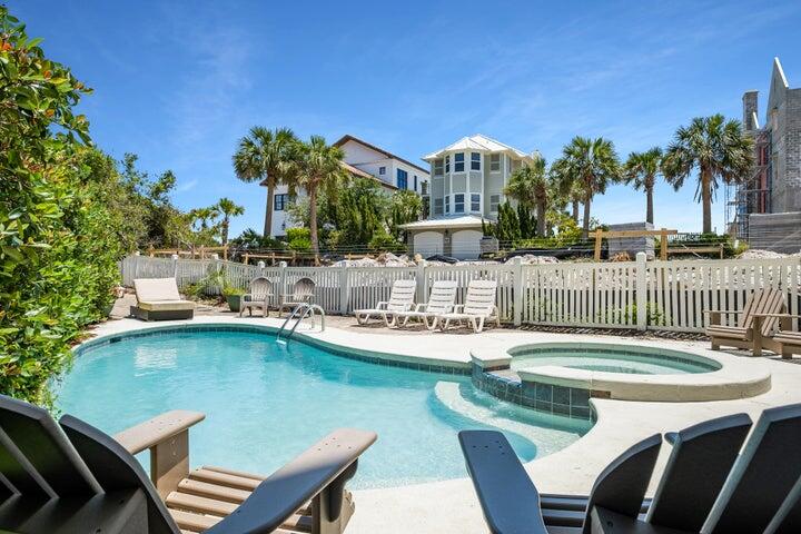 410 Beachfront Trail Santa Rosa Beach, FL 32459 - Photo 37 of 102 a view of a house with pool and chairs