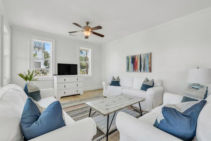 410 Beachfront Trail Santa Rosa Beach, FL 32459 - Photo 49 of 102 a living room with furniture and a flat screen tv