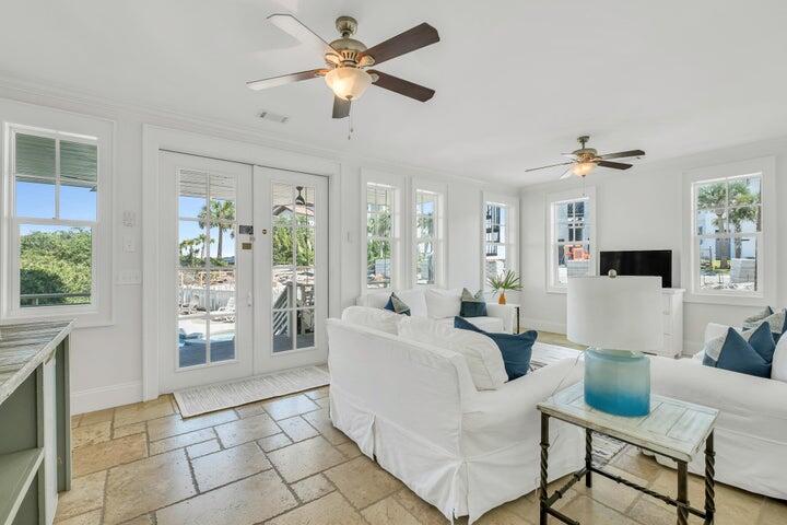 410 Beachfront Trail Santa Rosa Beach, FL 32459 - Photo 50 of 102 a living room with furniture a chandelier fan and a large window
