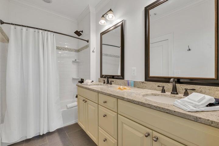 410 Beachfront Trail Santa Rosa Beach, FL 32459 - Photo 56 of 102 a bathroom with double sink and a mirror