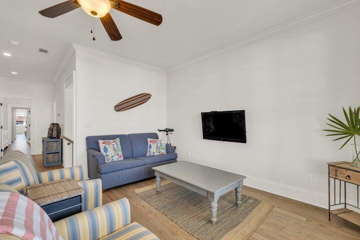 410 Beachfront Trail Santa Rosa Beach, FL 32459 - Photo 59 of 102 a living room with furniture and a flat screen tv