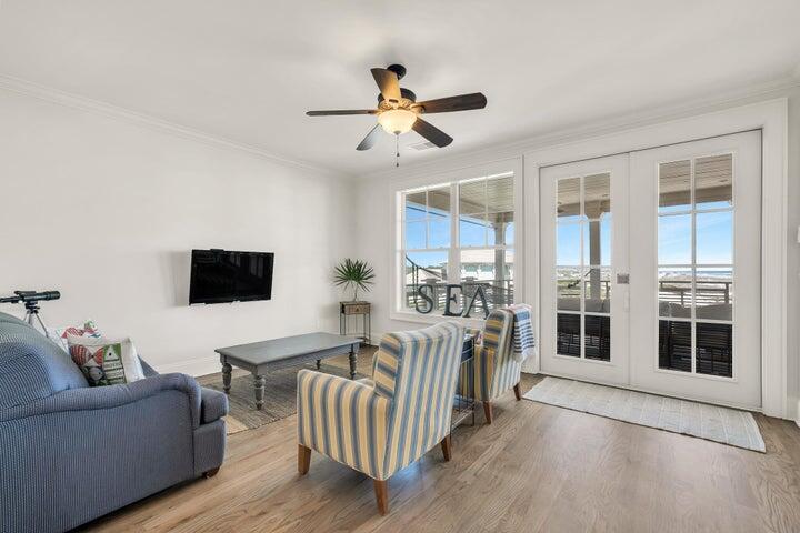 410 Beachfront Trail Santa Rosa Beach, FL 32459 - Photo 60 of 102 a living room with furniture and a flat screen tv