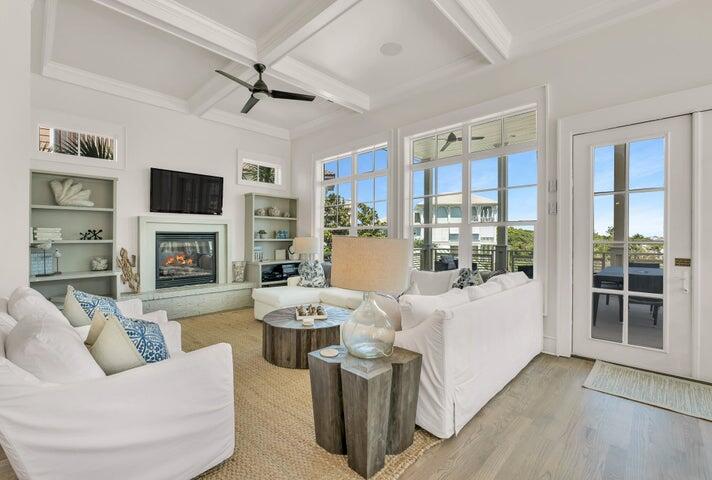 410 Beachfront Trail Santa Rosa Beach, FL 32459 - Photo 10 of 102 a living room with furniture fireplace and flat screen tv