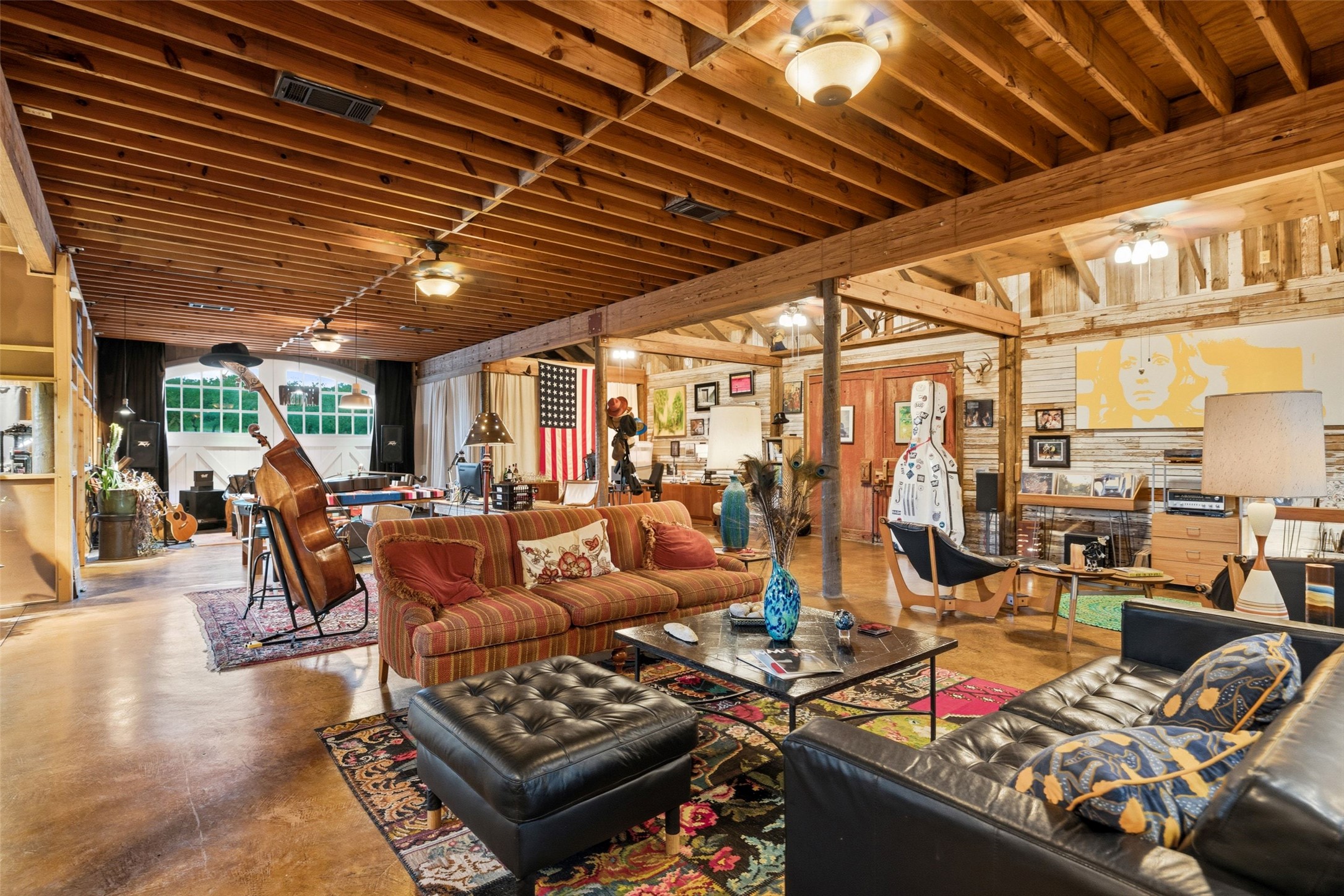 505 Red Corral Ranch Road Wimberley, TX 78676 - Photo 37 of 40 Exposed wood beams and rich wood flooring anchor this spacious, versatile great room.