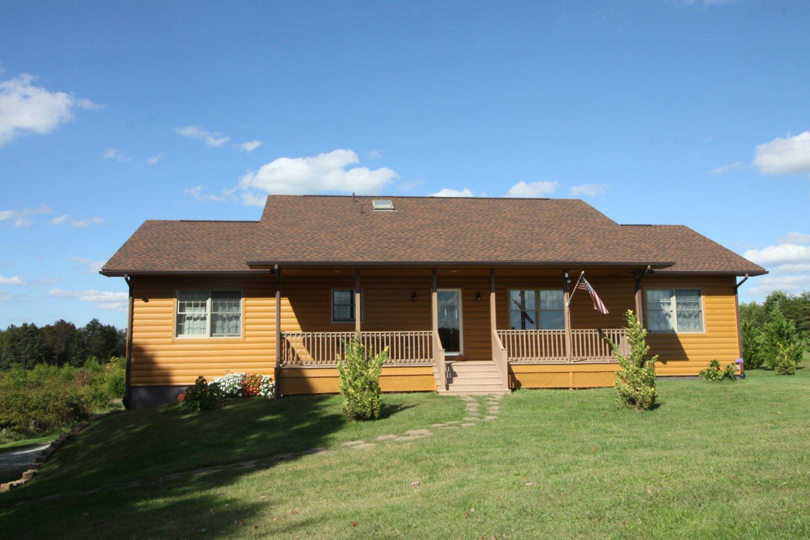 2615 Hatchett Road Penhook, VA 24137 - Photo 1 of 38 a front view of a house with a garden