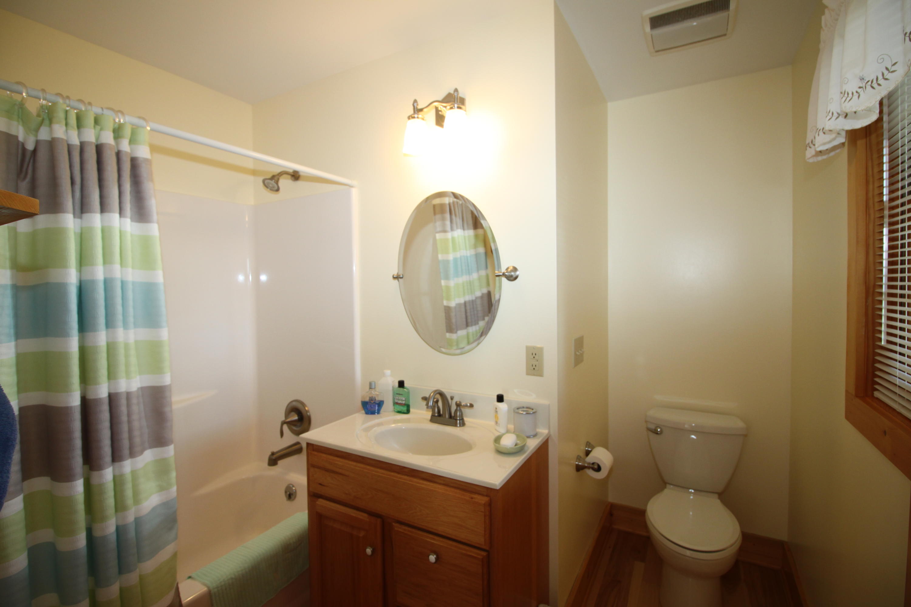 2615 Hatchett Road Penhook, VA 24137 - Photo 14 of 38 a bathroom with a sink toilet and shower