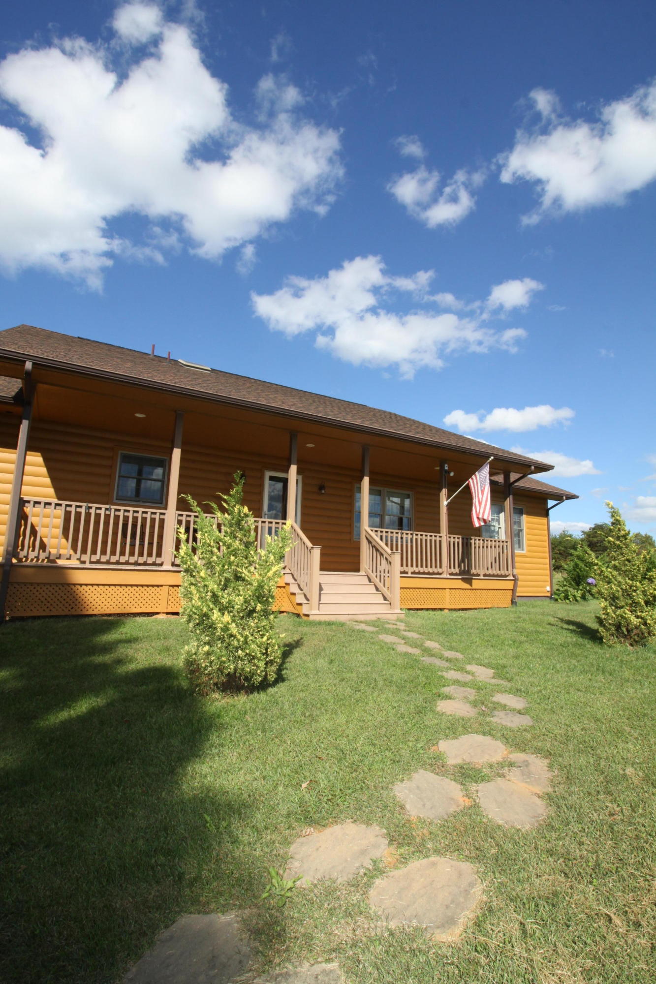 2615 Hatchett Road Penhook, VA 24137 - Photo 3 of 38 a front view of a house with a garden