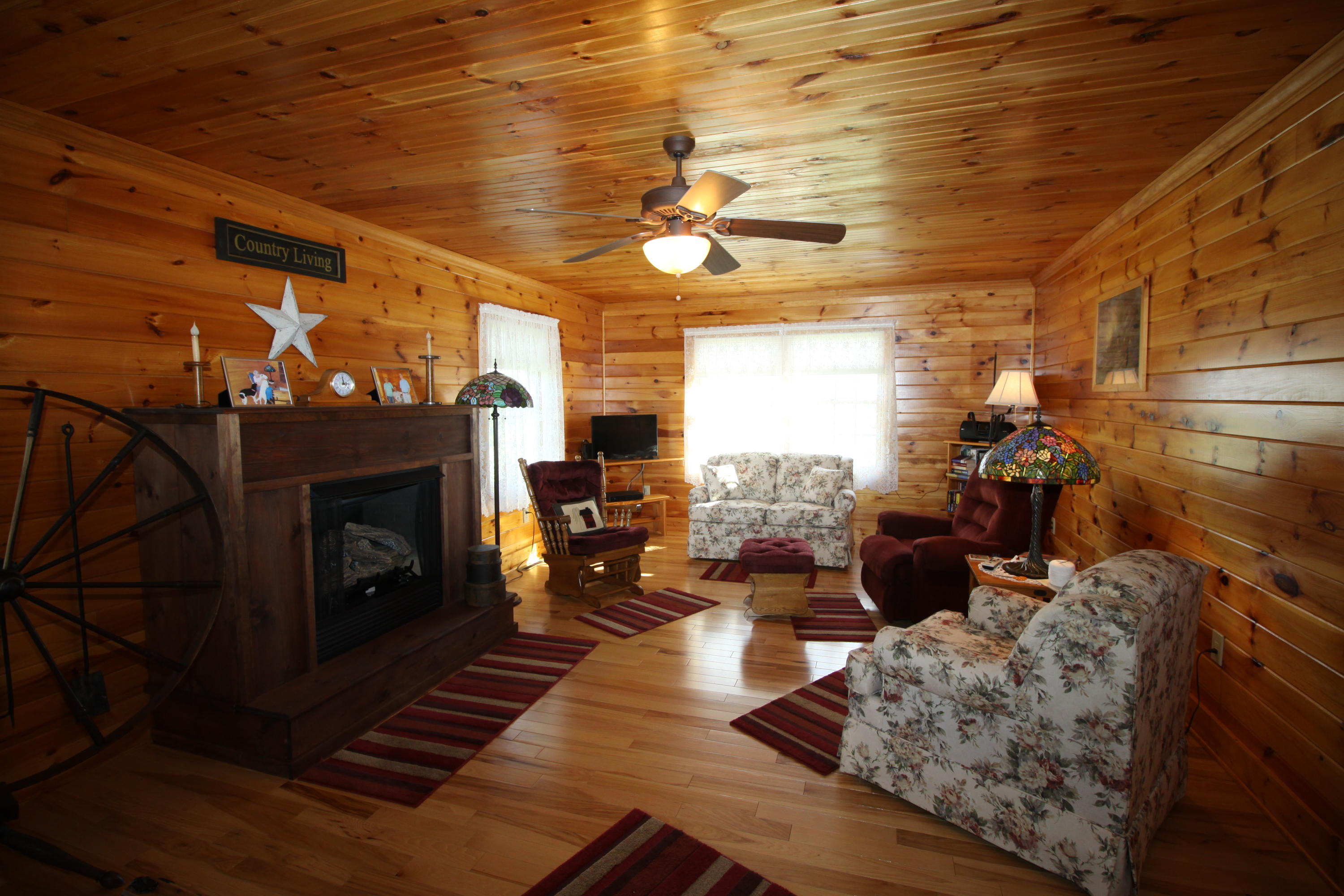 2615 Hatchett Road Penhook, VA 24137 - Photo 29 of 38 a living room with furniture and a fireplace