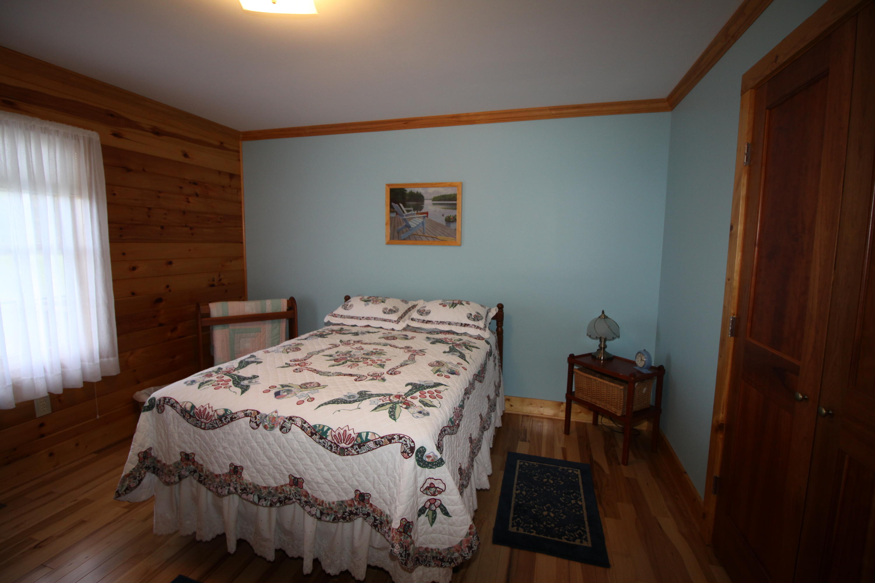 2615 Hatchett Road Penhook, VA 24137 - Photo 33 of 38 a bedroom with a bed and wooden floor