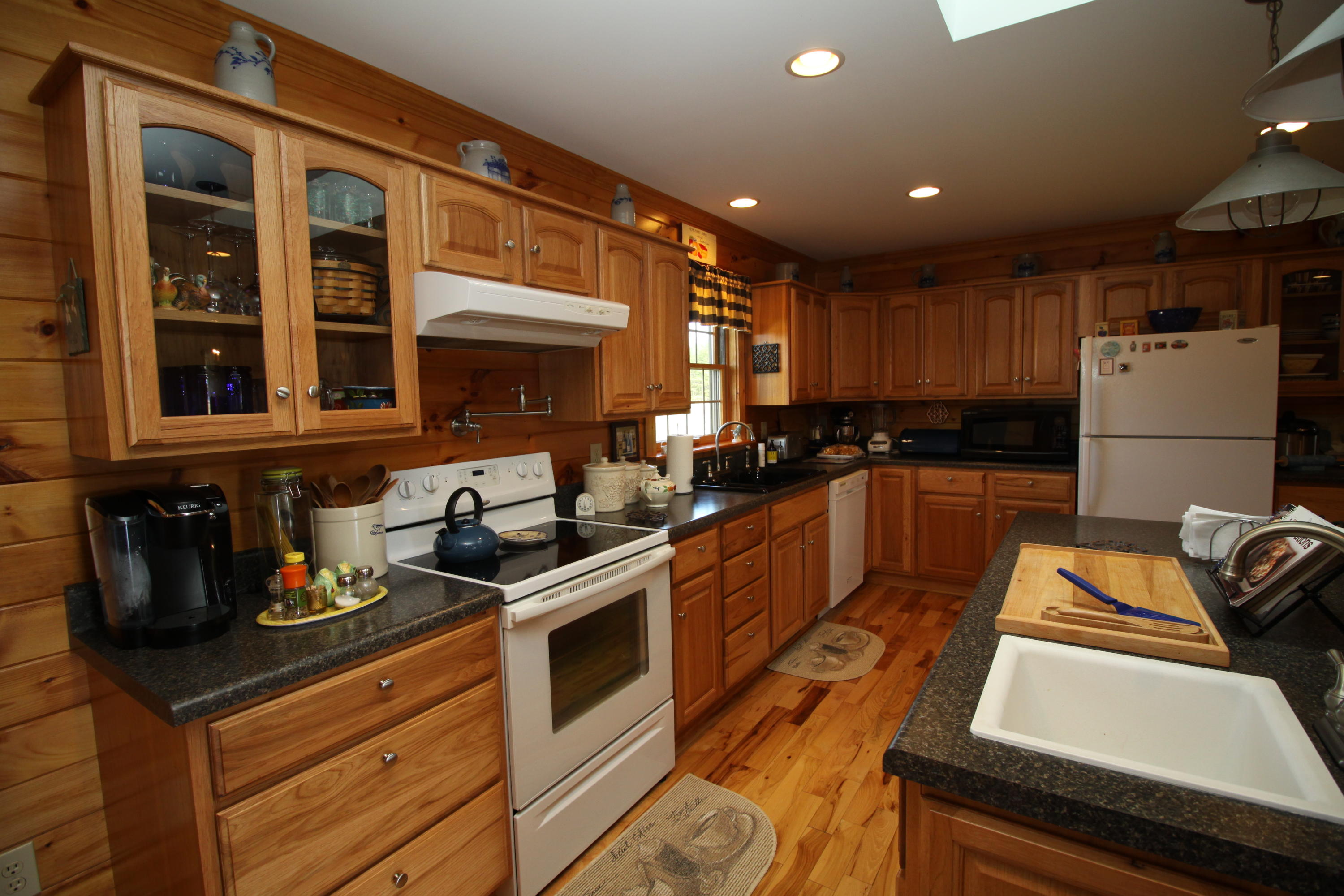 2615 Hatchett Road Penhook, VA 24137 - Photo 7 of 38 a kitchen with stainless steel appliances granite countertop a stove and a sink