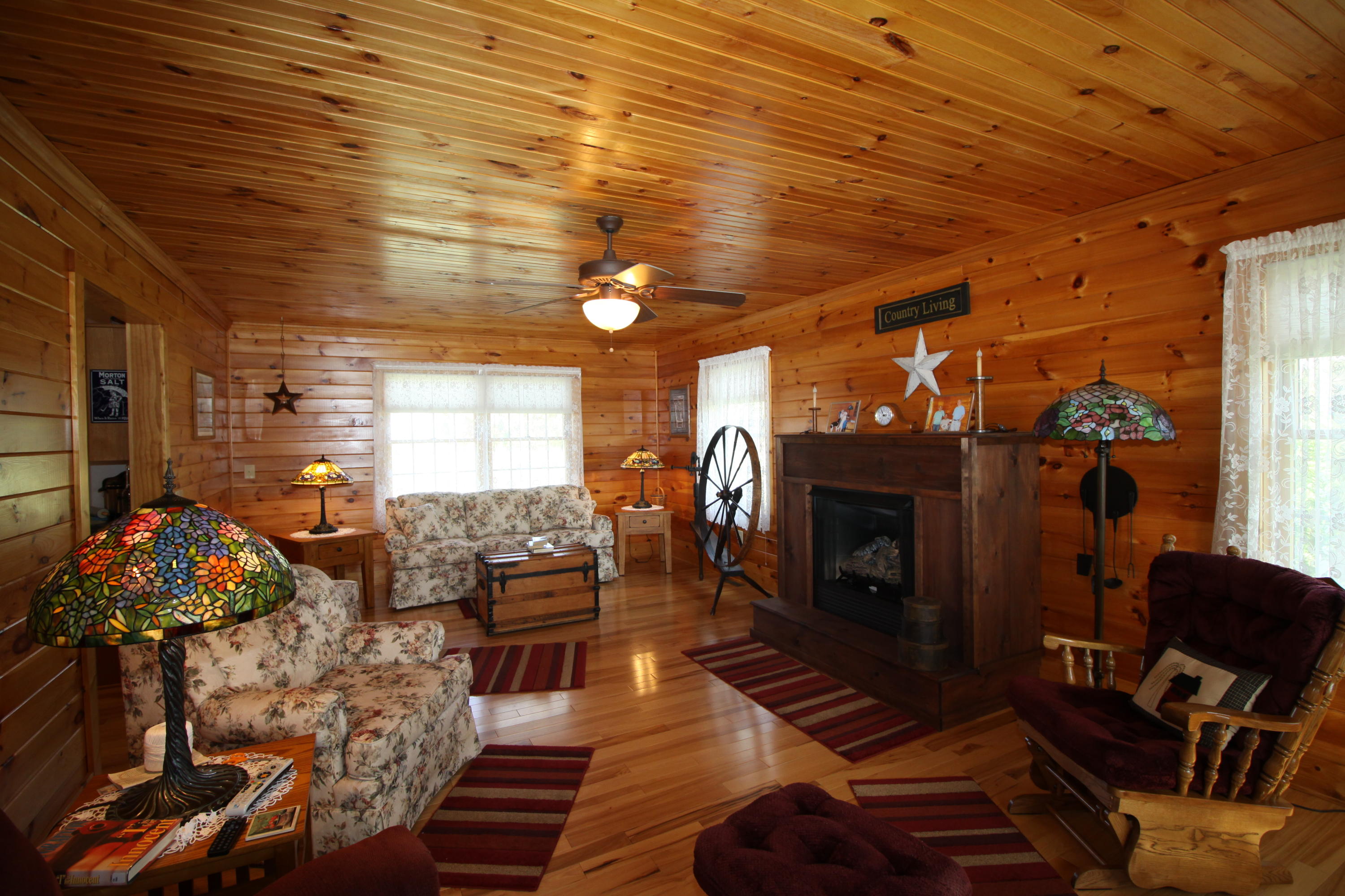 2615 Hatchett Road Penhook, VA 24137 - Photo 10 of 38 a living room with furniture and a fireplace