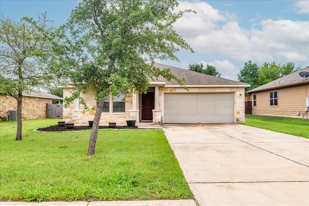 1061 Violet Lane Kyle, TX 78640 - Photo 1 of 34 Front view of lawn, 2 car garage